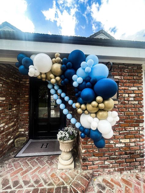 "Want to add, or remove a color option? This balloon arch is customizable, message me!   Your balloon arch kit includes everything you will need to create a beautifully styled, Instagram-worthy garland. We have curated gorgeous colors and professional-grade balloons in three sizes (5\", 11\", and 18\"  in your kit. You will receive a detailed instruction booklet, ribbon, balloon tape, glue dots, and wall hooks (may not work with all walls/paint types) to hang your garland.  The 5\" balloons can be difficult to inflate with your mouth, so you won't regret adding our dual-action, manual balloon pump before checking out. It will save your lungs, and your time, allowing your energy to be focused on other party shenanigans.     Please see the picture cards above for balloon sizes, quantities, a Garage Balloon Garland, Window Balloon Decoration, Welcome Home Balloon Decor, Evil Eye Balloon Garland, Navy Blue And Silver Birthday Party, Shades Of Blue Balloon Arch, Front Door Balloon Arch, Blue Baby Shower Balloon Arch, Blue Ombre Balloon Garland