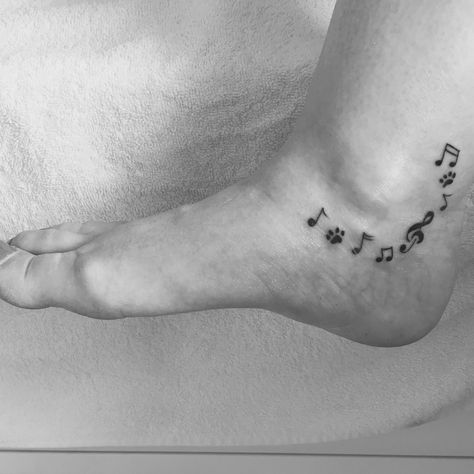 Mixture of paw prints and music notes Music Lyric Tattoos, Clef Tattoo, Treble Clef Tattoo, Music Notes Tattoo, Lyrics Tattoo, Note Tattoo, Tat Ideas, Music Note, Dog Tattoos