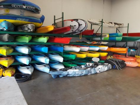 Kayak Rental Shop, Kayak Rental Business, Boat Storage Ideas, Kayak Hanger, Beer Garden Design, Paddle Board Storage, Garage Business, Sports Storage, Fishing Storage