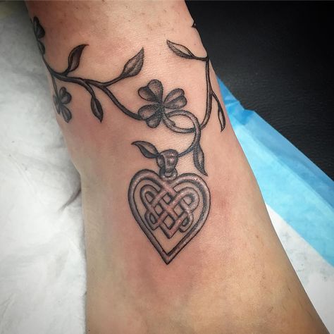 Shamrock and Celtic Heart Anklet Tattoo | Tattoo Ideas and Inspiration Celtic Tattoo For Women Irish, Celtic Heart Tattoo, Celtic Tattoo For Women, Yggdrasil Tattoo, Heart Tattoo Ideas, Heart Tattoos With Names, Tattoos With Names, Scottish Tattoos, Shamrock Tattoos