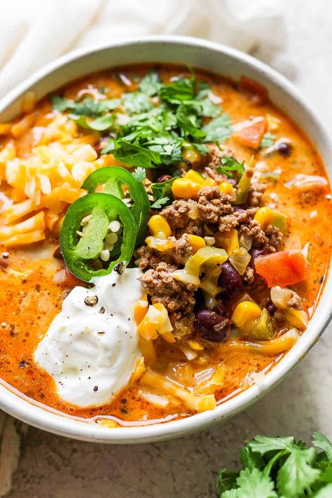 Creamy Taco Soup - a seriously delicious homemade creamy taco soup recipe that is perfect for those cold weather months! Dinner is served! #creamytacosoup #creamytacosouprecipe #creamytacosouprecipegroundbeef #creamytacosouprecipeeasy Creamy Taco Soup Recipe, December Meals, Creamy Taco Soup, Crock Pot Taco Soup, Taco Soup Recipe Easy, Mexican Casserole Recipe, Taco Soup Crock Pot, 12 Tomatoes Recipes, Taco Soup Recipe