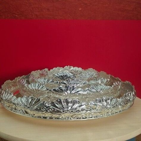 Serve your guests in style with these stunning German silver tray sets! The flower tray set is perfect for home decor, while the 6 bowl set is great for snacks or sweets. Both make great housewarming gifts or prasad. Don't miss out on these beautiful pieces! #GermanSilver #HomeDecor #GiftIdeas #ServingTray #SnackBowls 🌸🍴  #eBay #eBayStore #eBaySeller #Tray #Bowling #Silver #indiancraftsbykanika #germansilver #ServingTray #SterlingSilver #ArtDeco #Floral