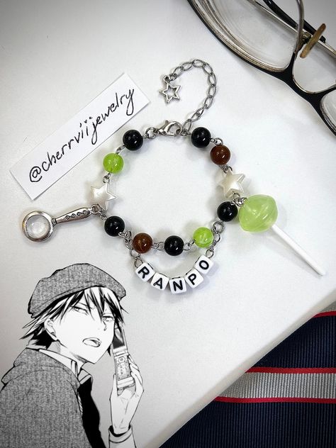 -Handmade Ranpo Edogawa inspired bracelet with dangling charms and name tag -Adjustable with semi-loose fit on smallest setting -Made with stainless steel, acrylic beads, and plastic charms -Take care when handling and do not tug on the bracelet, as it is handmade and delicate. May appear tangled occasionally but is easy to fix Plastic Charms, Ranpo Edogawa, Pony Bead Bracelets, Jewerly Beads, Kandi Bracelets, Diy Bracelets Patterns, Diy Bracelet Designs, 3 Friends, Bracelet Diy