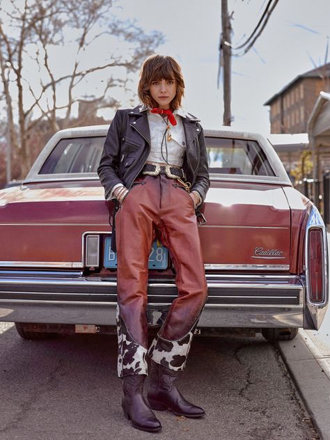 Cotton On’s cotton jacket under Oak’s leather jacket; Dsquared2’s leather pants with pony hair intarsia. Ariat boots; B-Low the Belt belt; Ambush necklace; Roxanne Assoulin bracelets; Versace necklace, bracelet and belt chain; vintage bolo tie and bandana. Ambush Necklace, Cowboy Vibes, Cowboy Bandana, Versace Necklace, Roxanne Assoulin, B Low The Belt, Belt Chain, American Western, Ariat Boots