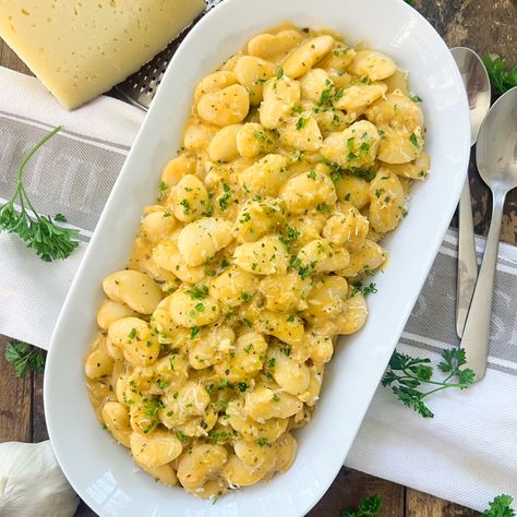 "These Creamy GARLIC Butter Beans are filled with flavors, made with simple ingredients and done in about 20 minutes. Serve them as a side dish next to some grilled fish or even as a main course next to a crunchy baguette. Either way, it’s the kind of food that’ll fill you with so much goodness. To make this recipe, I used canned butter beans. If you can’t find butter beans in your area, you can use other types of white beans. Such as great northern or even cannellini beans. You can also Northern White Beans Recipes, Garlic Flatbread Recipe, Garlic Flatbread, Butter Beans Recipe, Beans Recipes, Canned Butter, Onion Sauce, Healthy Sandwiches, Flatbread Recipes