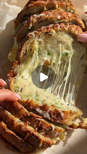 Rebecca Gawthorne - Dietitian & Nutritionist 🌴 on Instagram: "Let’s make Cheesy Pull-apart Garlic Bread 🧄🍞 @nourish_naturally X @julzhealth 💛👌🏼 

The perfect easy side dish that’s incredibly delicious 👌🏼

Ingredients:
1 head of garlic
1 Tbsp extra virgin olive oil (EVOO) 
Pinch of salt
125g butter, softened 
1/4 cup fresh parsley, finely chopped
1 small seeded sourdough loaf, sliced
1 cup shredded mozzarella

Method:
1. Preheat oven to 180C. 
2. Slice top off garlic, drizzle with EVOO & sprinkle with salt. Wrap in foil and place in baking dish into oven for 30 minutes. 
3. Mix butter, parsley & roasted garlic in a small bowl. 
4. Spread the garlic butter on one side of the sourdough, then top with cheese. 
5. Repeat with remaining sourdough, creating a stack. 
6. Place stack into a Sliced Bread Garlic Bread, Pull Apart Garlic Bread, Sourdough Loaf, Garlic Cheese, Easy Side Dish, Garlic Head, Pull Apart, Shredded Mozzarella, Small Bowl