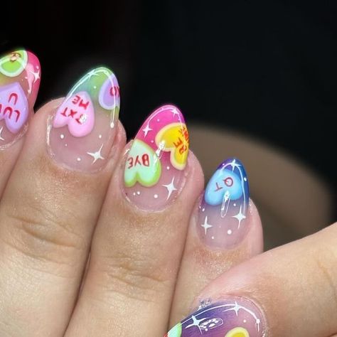 Ivy Anastasia | Nail Artist on Instagram: "Candy Hearts 🍭🌈💜 #handpaintednailart #candyhearts #kawaiinails #polygelnails #dallasnailartist #dallasnailtech #rainbownails Use code IVYGIRL for $$ off at SNA.com! @secret.nail.affair 💗💅✨ Xoxo, Ivy Anastasia 🦋" Cute Retro Nail Designs, Multicolor Valentines Nails, Valentine’s Day Conversation Hearts Nails, Valentines Nail Polish Ideas, February Nail Art Designs, Cartoon Heart Nails, Candy Heart Valentines Nails, Sweet Heart Candy Nails, Valentines Candy Heart Nails