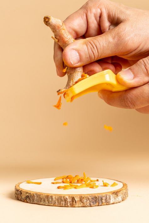 Slicing fresh turmeric Premium Photo | Premium Photo #Freepik #photo #background #food #wood #table Turmeric Aesthetic, Food Shoot, Background Food, Fresh Turmeric, Cosmetics Photography, Common Ground, 50 Million, Background Decoration, Photo Background