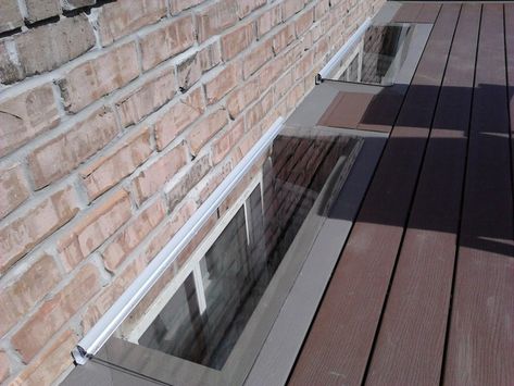 Deck Window Well, Deck Around Basement Window, Egress Window Front Of House, Deck Around Egress Window, Deck Over Basement Window, Window Well Cover Ideas, Basement Window Well Covers, Egress Window Well, Basement Window Well