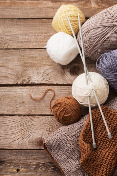 Knitting and knitting needles on a wooden surface¡ Knitting Wool Yarns, Crocheting Photography, Crochet Photography Ideas, Knit Photography, Yarn Photography, Knitting Painting, Knitting Photography, Crochet Photography, Yarn And Needles