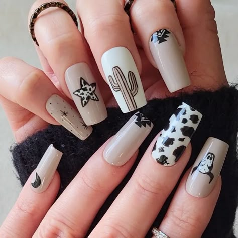 If you're a big fan of animal-inspired manicures, then brown cow print nails might be just what you need for your next nail design project! Includes beautiful brown nail polish designs for short nails, long nails, coffin nails, almond nails and many other options. Press On Nails Western, Black And Gold Cow Print Nails, Western Print Nails, Fall Cowgirl Nails, Black Western Nail Designs, Cowprint Nail Design Almond, Rodeo Nails Designs Westerns, Cow Print Fall Nails, Fall Nails Cow Print