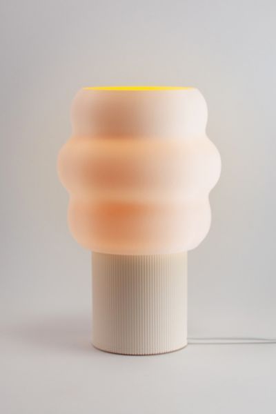 The Jelli Table Lamp finds its creative spark in the playful contours of soft serve ice cream, resulting in a design that’s whimsical and unique. The warm glow will bring happy vibes to any space. The Jelli Table Lamp is a great addition to your working desk or bedside table. The Jelli Table Lamp is designed, 3D printed, and hand assembled by Honey and Ivy Studio in Portland, Oregon. The 3D printing process is similar to making ceramic pottery in that each printed part is unique and has its own Useful 3d Prints, Furniture Apartment, Bead Loom Designs, Unique Table Lamps, 3d Printer Designs, Uo Home, 3d Lamp, Soft Serve Ice Cream, 3dprinting Design