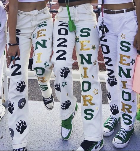 Cute green and gold senior pants outfit bottoms Spirit Week Outfits Homecoming, School Spirt Pants, Cute School Spirit Outfits, School Spirt Pants Ideas, Spirit Day Pants Ideas, Football Game Pants Painted, Class Of 23 Senior Pants, Senior Spirit Week Ideas High Schools, Green And Gold School Spirit Outfit