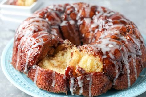 Monkey bread from scratch - yeasted dough rolled in a brown sugar cinnamon mixture. Baked in a bundt pan and drizzled with a vanilla icing. Can be made the night before and baked the morning of. Perfect for Easter, Mother's day, or whenever a decadent brunch breakfast dish is needed! Monkey Bread From Scratch, Homemade Monkey Bread, Cinnamon Monkey Bread, Bread From Scratch, Monkey Bread Recipe, Easter Brunch Food, Baking Bread Recipes, Vanilla Glaze, Homemade Dough