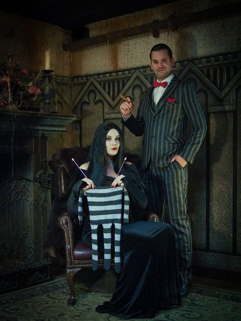 Goth Family Halloween Costumes, Pregnant Morticia Costume, Addams Family Maternity Shoot, Addams Family Nursery, Addams Family Gender Reveal, Adams Family Gender Reveal, Adams Family Photoshoot, Spooky Pregnancy Photoshoot, Adams Family Baby Shower Ideas