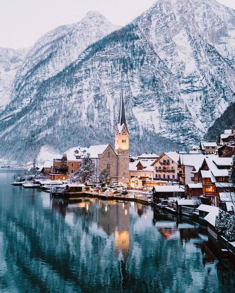 Hallstatt Austria famous viewpoint in Winter via @finduslost | Hallstatt, Austria is one of the most picturesque European towns I have ever been to. Stay overnight in this dream destination to avoid the crowds and take full advantage of its stunning scenery in the evenings and early morning. Hallstatt in winter is just as magical with the snow covered rooftops and mist over the mountains. #hallstatt #austria #europeantravel #bucketlisttravel #finduslost Kauai Travel, Vietnam Itinerary, Hallstatt Austria, Stunning Scenery, Greece Travel Guide, Dream Land, Stay Overnight, Amsterdam Travel, 수채화 그림