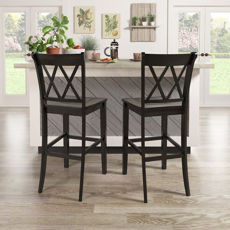 Sitting at the perfect height for kitchen islands, breakfast bars, and pub tables, this stool has a leg up on other seating options. Crafted from solid wood, it showcases a neutral hue sure to blend in with any color palette you pick, and a double X design on its back for a traditional look. Plus, there's a convenient footrest to keep you comfortable while you linger over some evening snacks or your morning coffee. Best of all, this stool arrives in a set of two. Kitchen Stools With Back, Farmhouse Bar Stools, Tall Bar Stools, Pub Tables, Bar Stools Kitchen Island, Dining Table Dimensions, High Top Tables, Wooden Counter, Bar Stools With Backs