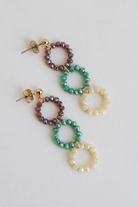 The finishing touch to all your best looks is the Melissa Teal Beaded Circle Drop Earrings! These trendy gold earrings start with a stud post back and fall to colorful beaded circles. Add these fun earrings to a floral dress + sandals to add a girly touch to your look! Gold Plated Beaded Circles Stud Post Back One Size | Length 2” Trendy Gold Earrings, Beaded Circle, Diy Jewelry Making Tutorials, Fall Bead, Homemade Earrings, Beaded Earrings Diy, Beachglass Jewelry, Jewelry Making Earrings, Handmade Jewelry Tutorials