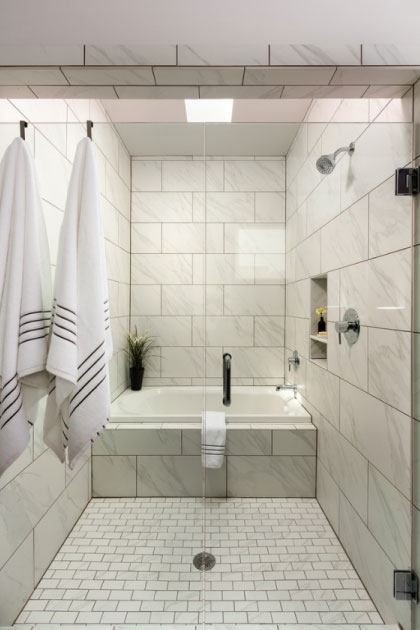 Cultured Marble Shower Surrounds or Tile? Here’s How To Decide. | Grabinski Group Carrara Tile Bathroom, Corner Bathtub Shower, Cultured Marble Shower Walls, Cultured Marble Shower, Marble Shower Walls, Bathroom Transitional, Tub Enclosures, Best Bathtubs, Grab Bars In Bathroom