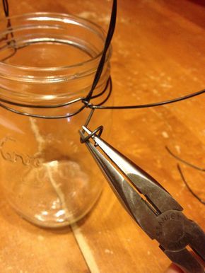 twisting wire for a handle | Turn a New/Used Mason Jar into a Lantern ~ Wire Handle Tutorial Art Fil, Mason Jar Lanterns, Diy Hanging Shelves, Mason Jar Projects, Jar Lanterns, Diy Jar Crafts, Wine Bottle Diy Crafts, Wooden Craft, Mason Jar Crafts Diy