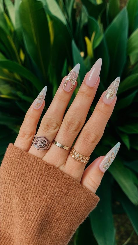 Discover the beauty of stunning nail designs with this elegant take on nail art! Featuring long, sleek nails adorned with intricate details and chic rings, this style is perfect for those looking to elevate their nail game. The subtle nude base enhances the creativity while the golden accents add a touch of glam. Perfect for every occasion, these nails are sure to turn heads!
.
#NailArt #NailDesign #FashionInspo #ElegantNails #NailTrends #NailGoals Matte Vs Glossy Nails, Cartoon Character Nails, Wedding Guest Nails, Spring Nail Art Designs, Stiletto Nail Designs, Festive Holiday Nails, Fall Nails Art, Glitter Gradient Nails, Coffin Nail Art