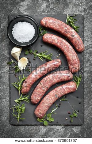 Raw sausages on slate, with herbs and spices.  Overhead view. - stock photo Meat Food Styling, Meat Photography, Pork Roasts, Meat Markets, Meat Shop, Food Photography Tips, Fresh Meat, Pork Sausage, White Meat