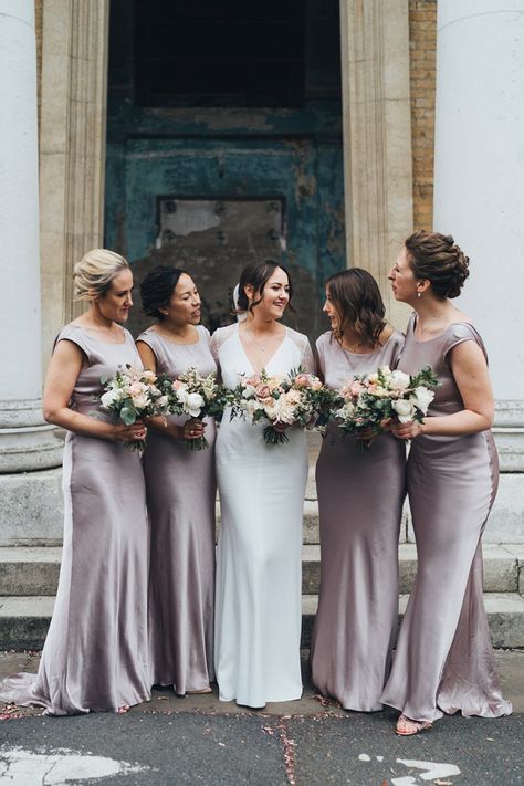 Bridal Party In Dusky Pink Bridesmaid Dresses With Bouquets | By Miss Gen | City Wedding | London Wedding | The Asylum Chapel | Candles At Wedding | Wedding Flowers | Bouquets | Lace Wedding Dress | Pink Wedding Flowers | Wedding Veil | Wedding Table Decor Pink Satin Bridesmaid Dresses, Dusky Pink Bridesmaid Dresses, Dusky Pink Bridesmaids, Pink Satin Bridesmaid, Charlie Brear Wedding Dress, Asylum Chapel, Blue Bridesmaid Dresses Short, Wedding London, Winter Bridesmaids