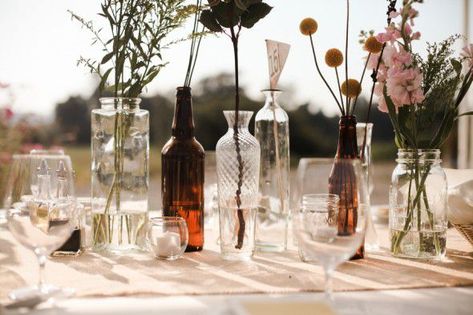 Random Glass Centerpieces, Random Bottle Centerpiece, Thrifted Wedding Vases, Glass Bottles Wedding Centerpieces, Thrifted Glass Centerpieces, Thrift Store Wedding Centerpieces, Thrifted Glass Wedding Centerpieces, Thrift Store Centerpiece Wedding, Assorted Vases Wedding Centerpieces