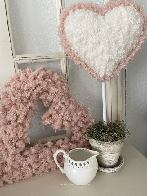 Do you love topiaries? I'm going to show you how to take a Dollar Tree styrofoam heart and turn it into a beautiful DIY topiary to decorate for Valentine's Day! Learn how to make a topiary using Teddy Bear yarn and a styrofoam heart. This is a simple DIY project so grab your glue gun and let's get started! Please pin this and follow us for more DIY and seasonal decor inspiration! Valentines Day Door Decorations, Neutral Valentines Decor, Heart Topiary, Door Decorations Ideas, Diy Topiary, Valentines Day Door, Topiary Diy, Diy Valentines Day Wreath, Heart Craft