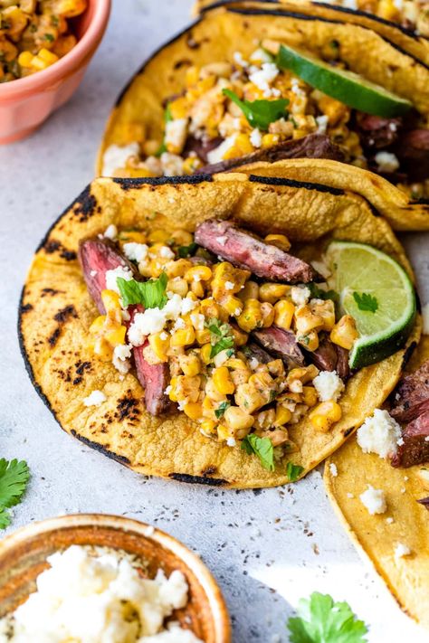 Grilled steak tacos topped with Mexican street corn is a match made in heaven for an easy summer dinner idea! #dinner #steak #tacos #grilling #summerrecipes #glutenfree #healthyrecipes #weightwatchers #fathersday Elote Tacos, Steak Taco Recipe, Skirt Steak Tacos, Street Taco Recipe, Easy Summer Dinner, Grilled Skirt Steak, Dinner Steak, Vegan Paleo Recipes, Steak Tacos