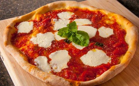 A traditional Italian pizza that originated in Naples, this classic is prepared with the simple, fresh ingredients of San Marzano tomatoes, fresh mozzarella, basil and olive oil. Pizza With Burrata, Mozzarella Burrata, Traditional Italian Pizza, Burrata Pizza, Pizza Italy, Romans Pizza, Individual Pizzas, Mozzarella Pizza, Buffalo Mozzarella