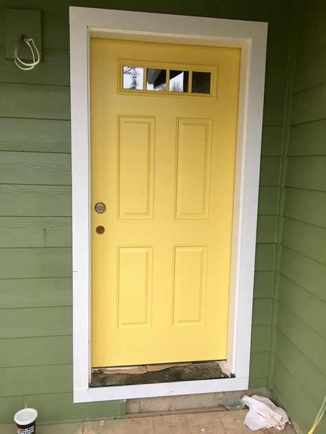 (Yellow)Daffodil door with (green) artichoke paint by Sherman Williams Dark Green House Yellow Door, Green House Yellow Door, Exterior House Paint Colors, House Doors Colors, Sage Green House, Yellow Front Door, Green Exterior House Colors, Green House Exterior, Green Siding