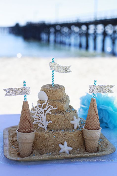 sandcastle cake - these step-by-step instructions make it easy to make this stunning kids birthday party cake! Sandcastle Cake, Sand Castle Cakes, How To Make Sand, Beach Theme Birthday, Ocean Theme Birthday, Ocean Birthday Party, Beach Birthday Party, Ocean Birthday, Castle Cake