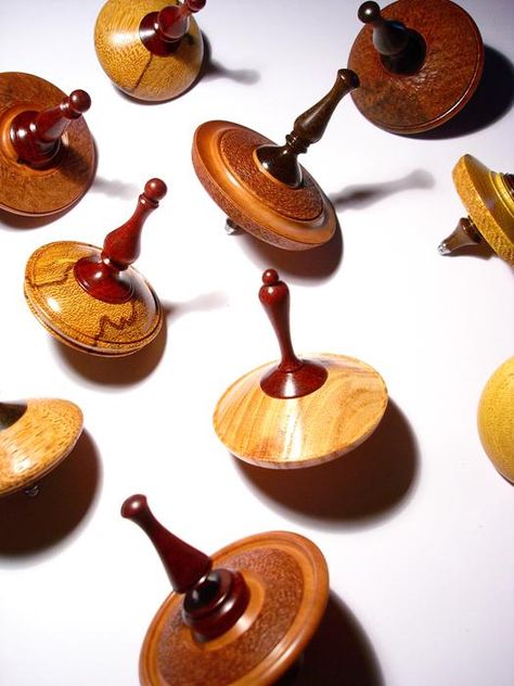 Made in Italy: Unique, Handcrafted Wooden Spintops | ITALY Magazine Spinning Tops Design, Cheap Diy Crafts, Wooden Objects, Italy Magazine, Spinning Tops, Lathe Projects, Wood Shop Projects, Wooden Accessories, Wood Turning Projects