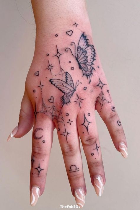 Feminine Hand Tattoos For Women, Tattoo With Stars, Masterpiece Tattoo, Butterfly Hand Tattoo, Beauty Transformation, Tattoo 2024, Hand And Finger Tattoos, Cute Hand Tattoos, Pretty Hand Tattoos