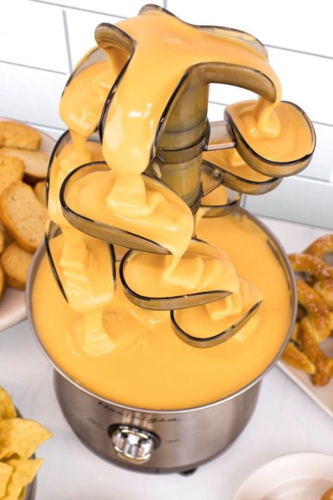 A mesmerizing stainless steel fondue fountain that sends an elegant flow of chocolate, nacho cheese, ranch, sauces, and much more down four cascading tiers. Nacho Cheese Fountain, Cheese Fountain, Fondue Fountain, Chocolate Cheese, Nacho Cheese, Nachos, Sauce, Cheese, Stainless Steel