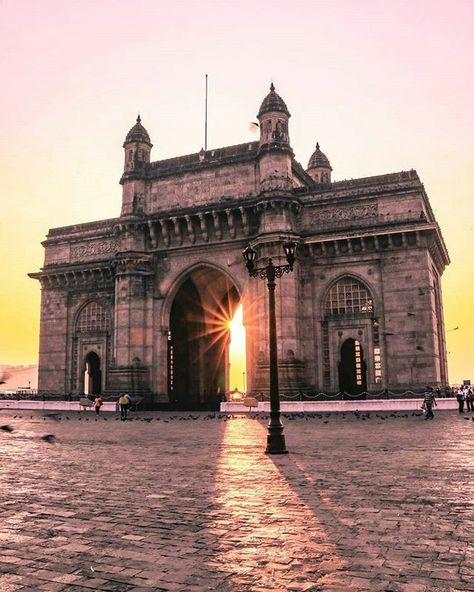 The Gateway of India is, without doubt, one of the most popular tourist attractions in India. It is located at Apollo Bunder Waterfront and overlooks the Arabian Sea in the most beautiful way. One of the most distinguished monuments in Mumbai, it was built in the year 1924 by famous architect George Wittet as a commemoration of the visit of King George V and Queen Mary to Mumbai. The imposing structure of the monument is a beautiful confluence of Indian, Arabic and Western architecture. Mumbai India Travel, Gateway Of India Mumbai, Gateway Of India, India Tourism, India Travel Places, Gate Way, India Architecture, India Gate, British India