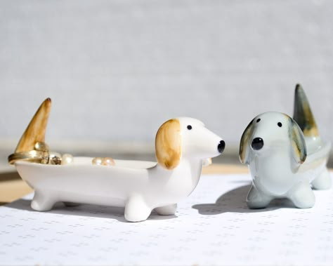 If you want it personalized, visit this listing  https://ummaarte.etsy.com/listing/1609158801 Best Dachshund Dog Gifts for Dachshund Lovers. The perfect gift for any dog lovers who love their dachshund! This adorable Dachshund shaped jewelry display tray is perfect for holding small items like rings, earrings and other trinkets on the dressing table or in the bathroom. It also makes a great gift for your best friend or yourself! Shaped like a miniature dachshund with its head up, this little dog Dog Jewelry Dish, Dog Related Crafts, Small Pottery Animals, Small Ceramic Trinkets, Dog Trinket Dish, Jewelry Organizer Pottery, Dog Lovers Gifts, Jewelry Organizer Clay, Dachshund Pottery