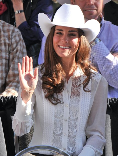 CafeMom.com : Cowboy Chic : 15 Times Kate Middleton Proved Blouses Are Anything But Boring -- Here's another 2011 throwback: Kate at the Calgary Stampede Parade in Canada. She dressed down for the event — in jeans, a giant belt buckle, and a cowboy hat — but her blouse is actually quite fancy. The delicate lace front detail adds some softness to the look, so she appears less like she just hopped off the ranch. Looks Kate Middleton, Prince William And Kate Middleton, Kate Middleton Pictures, Queen Kate, Middleton Family, Kate Middleton Outfits, Kate Middleton Photos, Catherine Elizabeth Middleton, Prince William And Catherine