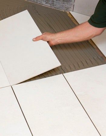 How Much Does Tile Installation Cost? Breaking Down the Cost to Install Tiles Subfloor Repair, How To Install Ceramic Tile Floor, How To Install Tile, Bathroom Tile Installation, Tile Leveling System, Rectified Tile, Square Tiles, Flooring Installation, Indoor Tile