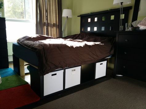 Kallax storage bed frame. DIY IKEA hack! Queen size bed w/underneath storage and mirrors on the headboard! Raised Bed Inside Built In Wardrobe, Ikea Bed Headboard, Ikea Queen Bed Frame, Kallax Bed, Ikea Platform, Ikea Storage Bed, Diy Bed Frame Plans, Ikea Platform Bed, Wardrobe Ikea