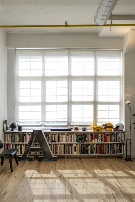 Long High Shelf, Low Shelf Decor, Long Low Shelf, Long Low Bookcase, Bookcase Stairs, Track Shelving, Minimal Loft, Shelf Of Books, Ny Loft