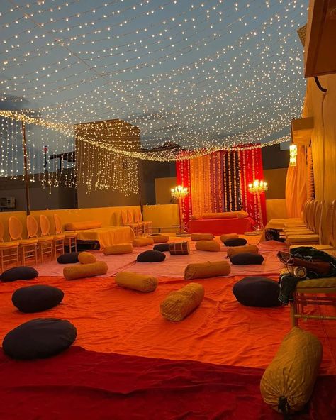 Mehandi Setup at rooftop in DHA Karachi 150 people seating arrangement with fairy lights roof and a Backdrop 📞 0348860235 #mehandi #decoration #wedding #Joyplanner #bride Terrace Light Decoration, Mehndi Decoration Ideas At Terrace, Rooftop Mehndi Decor, Outside Stage Ideas, Home Mehandi Decor, Lights Decoration For Wedding, Shadi Ghar Decor, Haldi Ceremony Decorations Terrace, Haldi Decoration At Terrace