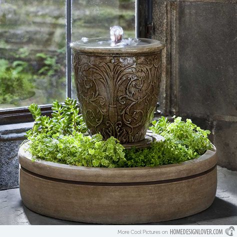 The details in this urn with fountain are very beautiful. It is even enhanced with the addition of green plants at its bottom. Small Indoor Water Fountains, Diy Solar Fountain, Taman Air, Indoor Water Features, Diy Water Fountain, Tabletop Water Fountain, Fountains Backyard, Indoor Water Fountains, Diy Fountain