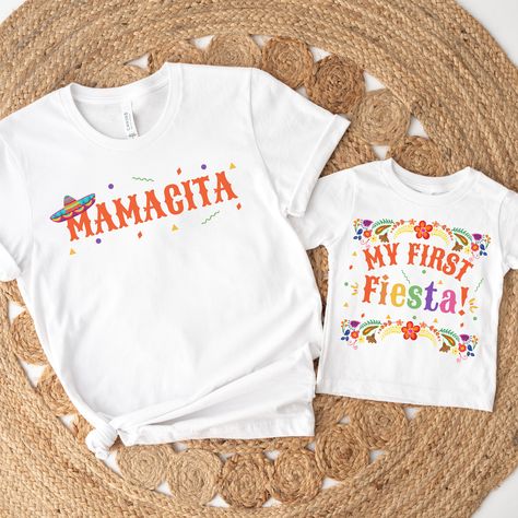 Get ready to spice up the fiesta at our little one's 1ST birthday bash with this festive My First Fiesta shirt! Vibrant colors and playful designs make it the perfect attire for our fiesta-loving amigos to celebrate in style! ------------------------------------------------------------------------------------------------------ 1. MAKE SURE THAT YOU HAVE READ ALL PERTINENT INFORMATION AND YOU HAVE SCROLLED THROUGH ALL OF THE PHOTOS. 2. ONCE THAT HAS BEEN COMPLETED, PICK YOUR SHIRT STYLE, SIZE, AND COLOR FROM THE DROPDOWN MENUS. 4. IF YOU HAVE MORE ITEMS TO ORDER, HIT THE BACK BUTTON AND REPEAT. 5. ONCE EVERYTHING IS IN YOUR CART, SELECT YOUR SHIPPING METHOD, INPUT YOUR CORRECT ADDRESS, AND HIT SUBMIT. 6. ENJOY :) ------------------------------------------------------------------------ OTHER First Fiesta Birthday Girl, Girls 3rd Birthday, Birthday Fiesta, 1st Birthday Shirt, Fiesta Birthday Party, Mexican Birthday, Third Birthday Party, Family Birthday Shirts, 1st Birthday Shirts