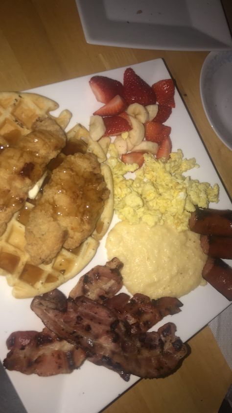 Chicken and waffles, grits, sausage, bacon, eggs, fruit Waffle House Grits Recipe, Grit Waffles, Chicken Waffles Brunch, Sausage Song Eggs Bacon Grits, Chicken And Waffle Aesthetic, Bacon Eggs, Food Therapy, Chicken And Waffles, Dinner Meals