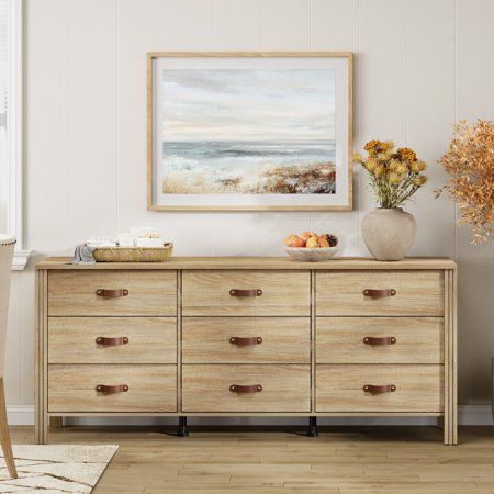 Organize your makeup, skincare products, jewelry, and personal items in style with this Farmhouse 9 Drawers Dresser. This nursery dresser designed with 13 spacious drawers that can provide large storage capacity. The solid wood base feet come with rubber pads to better prevent scratching your floor. Its smooth wooden surface is also easy to clean and maintain, ensuring it looks great with minimal effort. Beyond serving solely as a dresser, this versatile piece of furniture can fulfill multiple r Tan Dresser Furniture, Coastal Farmhouse Dresser, Big Dressers Master Bedrooms, Wall Of Dressers, Light Wood Dresser Bedroom, Big Dressers, Dresser For Nursery, Light Wood Furniture, Natural Wood Dresser