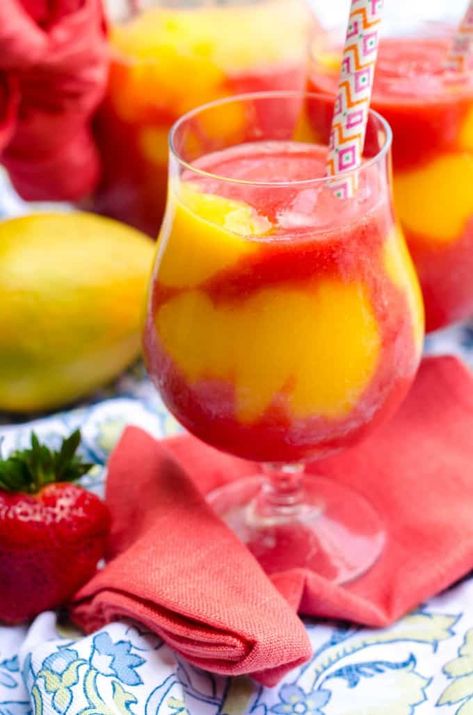 These Strawberry Mango Daiquiris are better than ANY concentrated mix- and just look at all that COLOR! | Go Go Go Gourmet @Go Go Go Gourmet Frozen Alcoholic Drinks Recipes, Frozen Mixed Drinks, Booze Recipes, Frozen Drinks Alcohol, Mango Cocktail, Slush Recipes, Greek Foods, Mango Drinks, Fun Summer Drinks