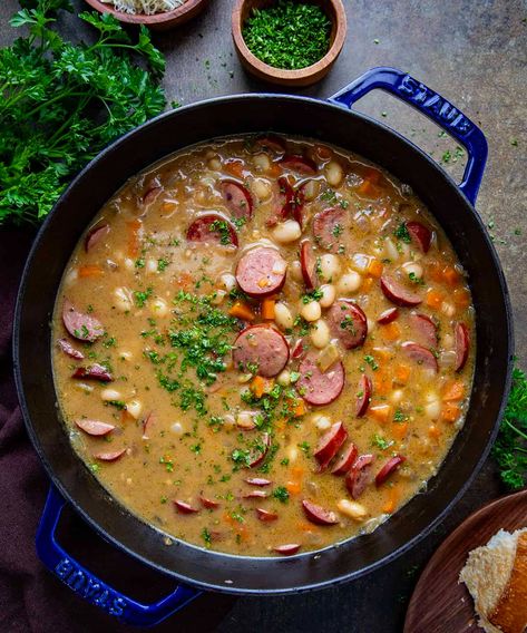 Creamy Bean Soup with Kielbasa combines the smokiness of Kielbasa with the creamy richness of beans and a savory broth. Creamy Bean Soup, Soup With Kielbasa, Navy Bean Recipes, Soup With Sausage, Sausage Soup, Savory Soups, White Bean Soup, Soup And Stew, Kielbasa