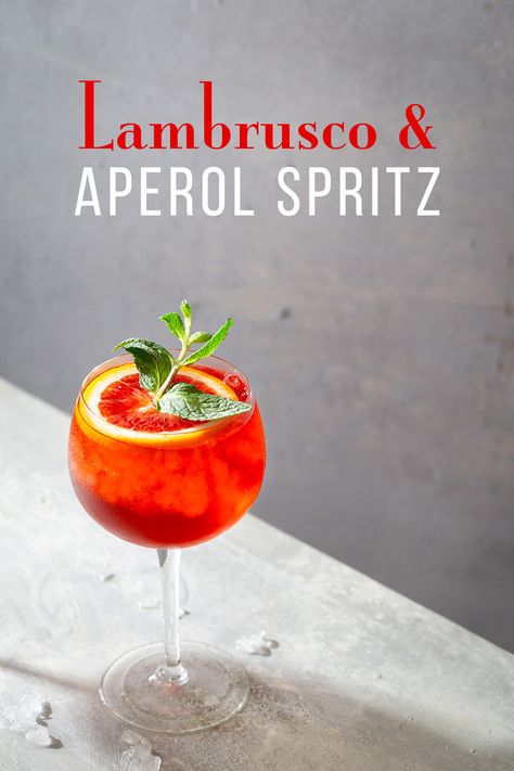 Lambrusco-Aperol Spritz - a new twist on the classic Aperol Spritz made with Lambrusco (instead of Prosecco), Aperol, and sparkling water. #aperolspritz #cocktailrecipe Lambrusco Spritz, Blueberry Lemon Drop, Lambrusco Wine, Blueberry Martini, Lemon Drop Cocktail, Cocktail Drinks Alcoholic, Vodka Cocktail, Lemonade Drinks, Summer Wines